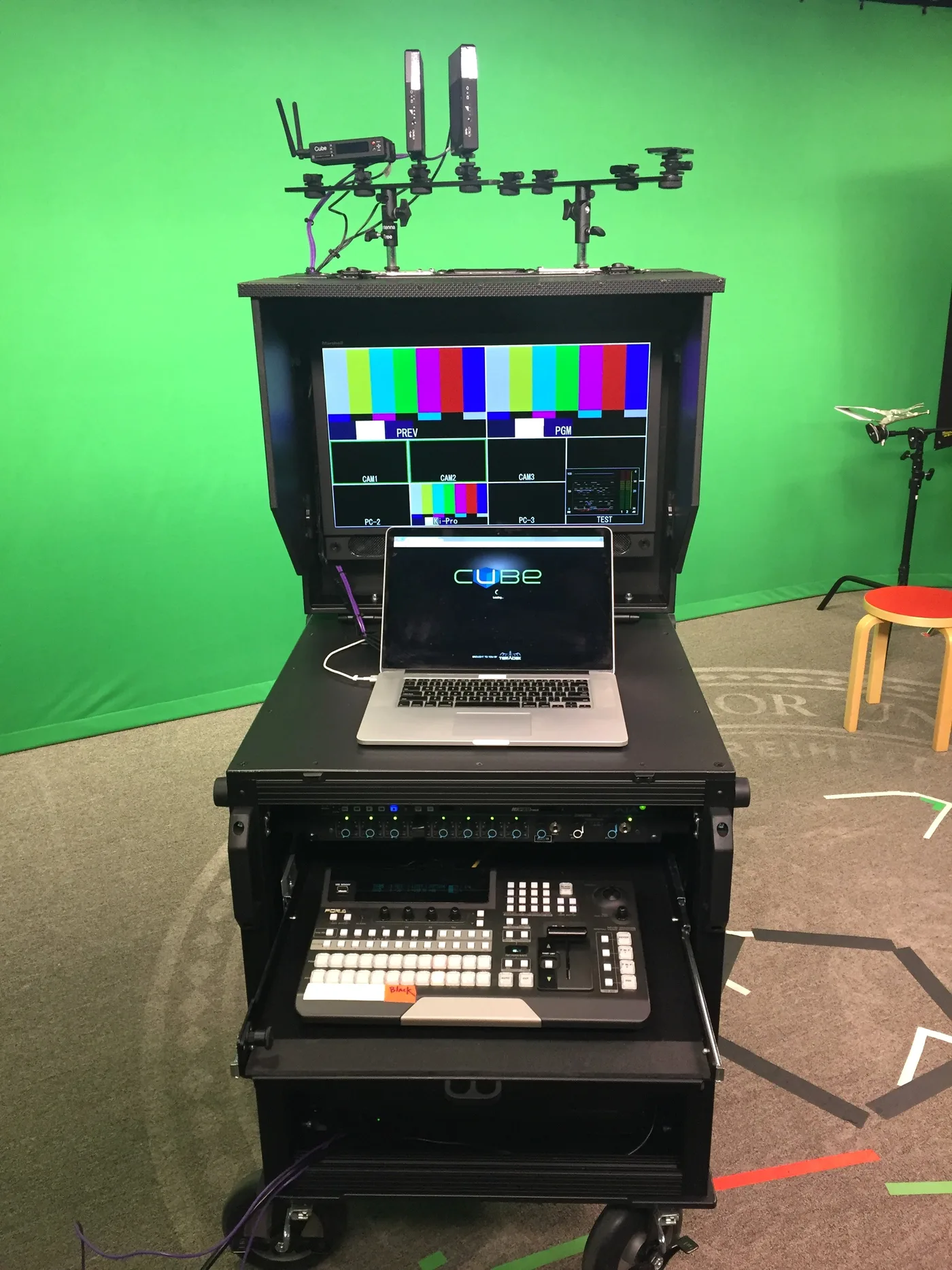 Bigfoot production cart at Stanford University — fully integrated with switcher, monitors, laptop, and wireless receivers in green screen studio