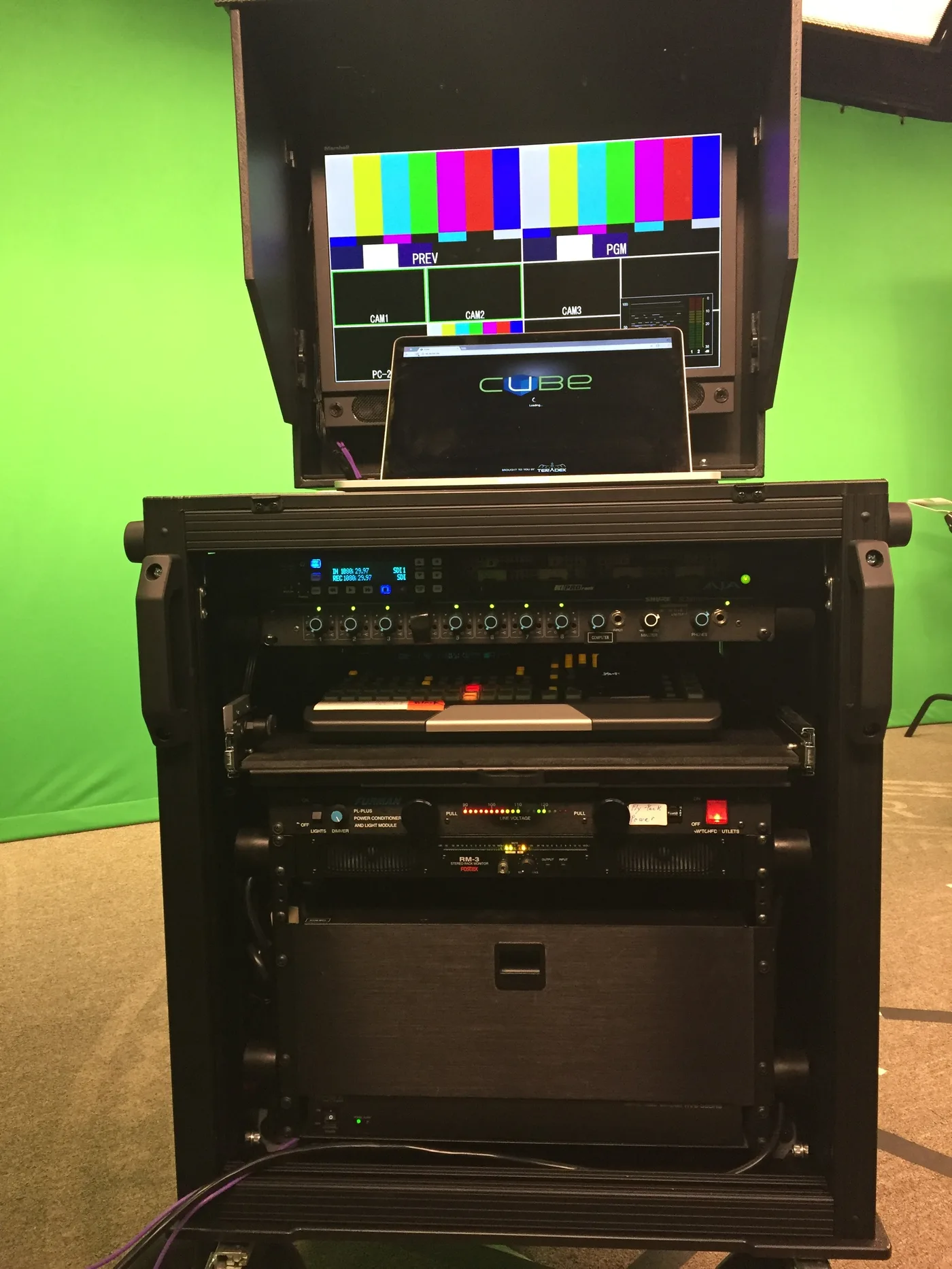 Stanford Bigfoot system open — production monitor showing multi-camera feeds, rack equipment visible