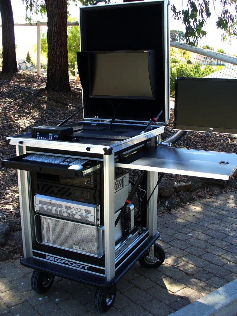 Early Bigfoot aluminum frame cart with fold-out side panel and monitor